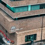 Aerial view of the Royal College of Art Studio Building in London showcasing modern brick architecture.